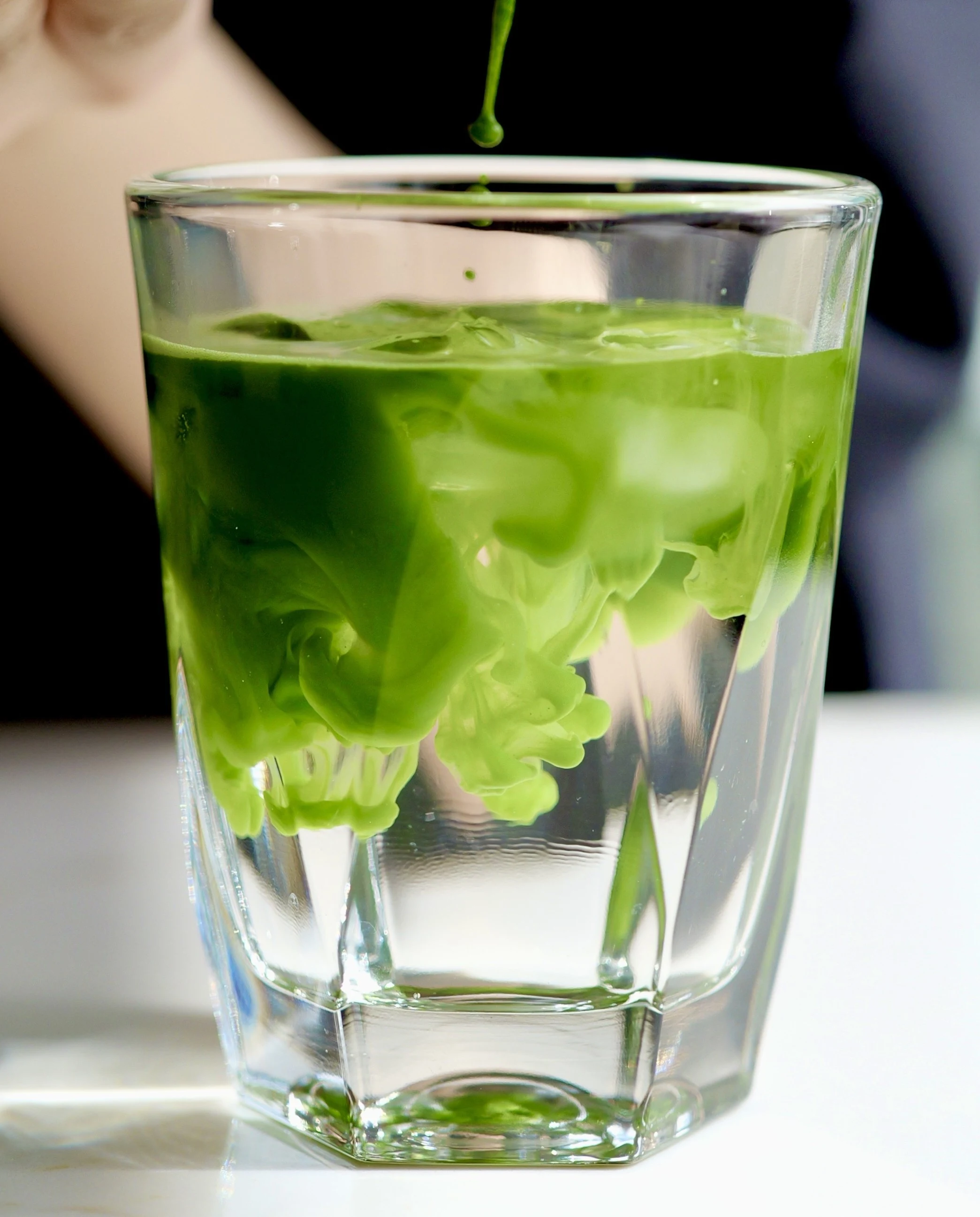 Iced matcha being poured into a glass at SUNNY M Cafe